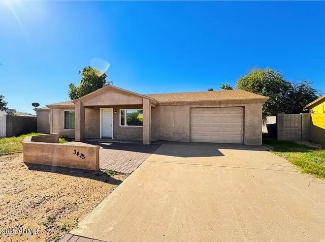 a front view of a house with a garage