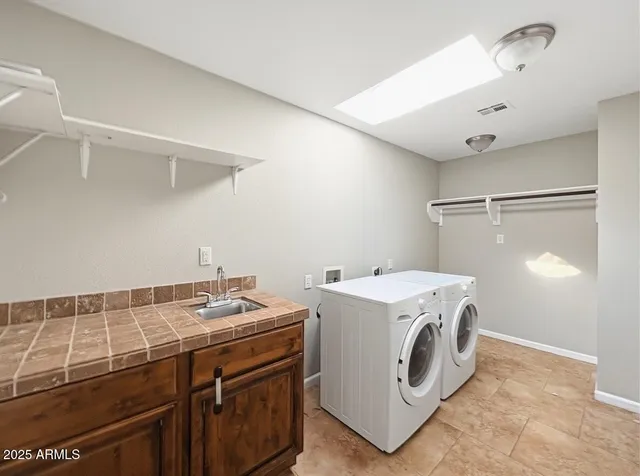 a utility room with dryer and washer