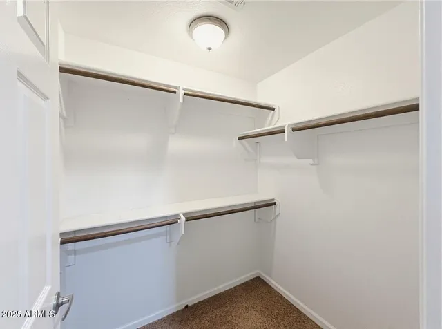 a view of an empty walk in closet