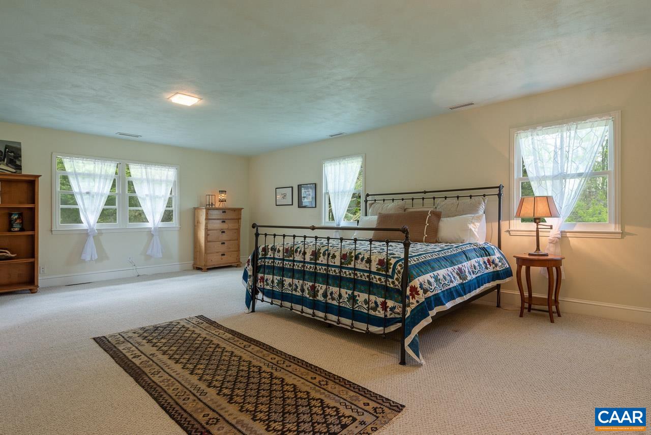 3944 Stony Point Road Keswick, VA 22947 - Photo 20 of 45 a bedroom with a bed and window
