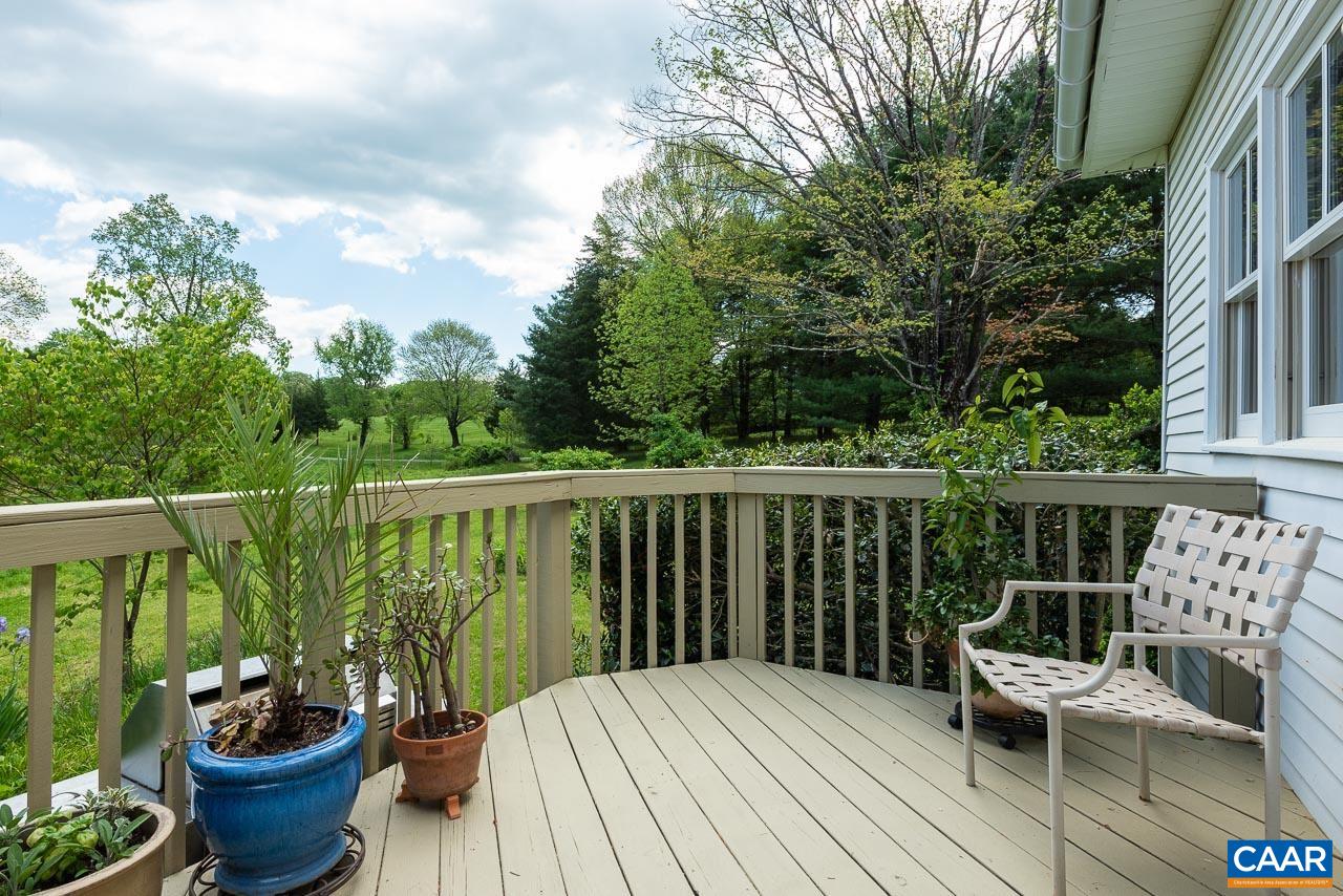 3944 Stony Point Road Keswick, VA 22947 - Photo 28 of 45 a balcony with wooden floor potted plants and outdoor seating