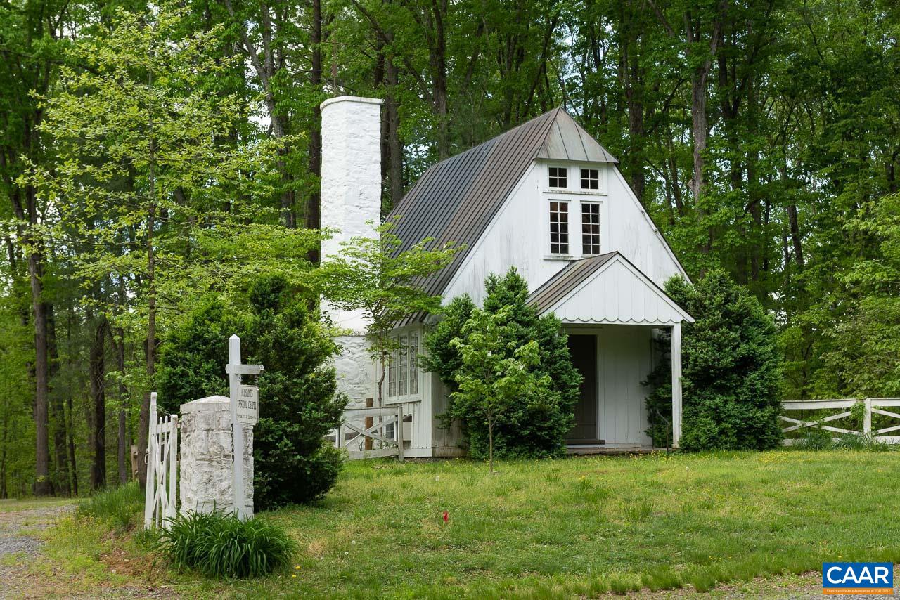 3944 Stony Point Road Keswick, VA 22947 - Photo 44 of 45 a front view of a house with a yard and trees