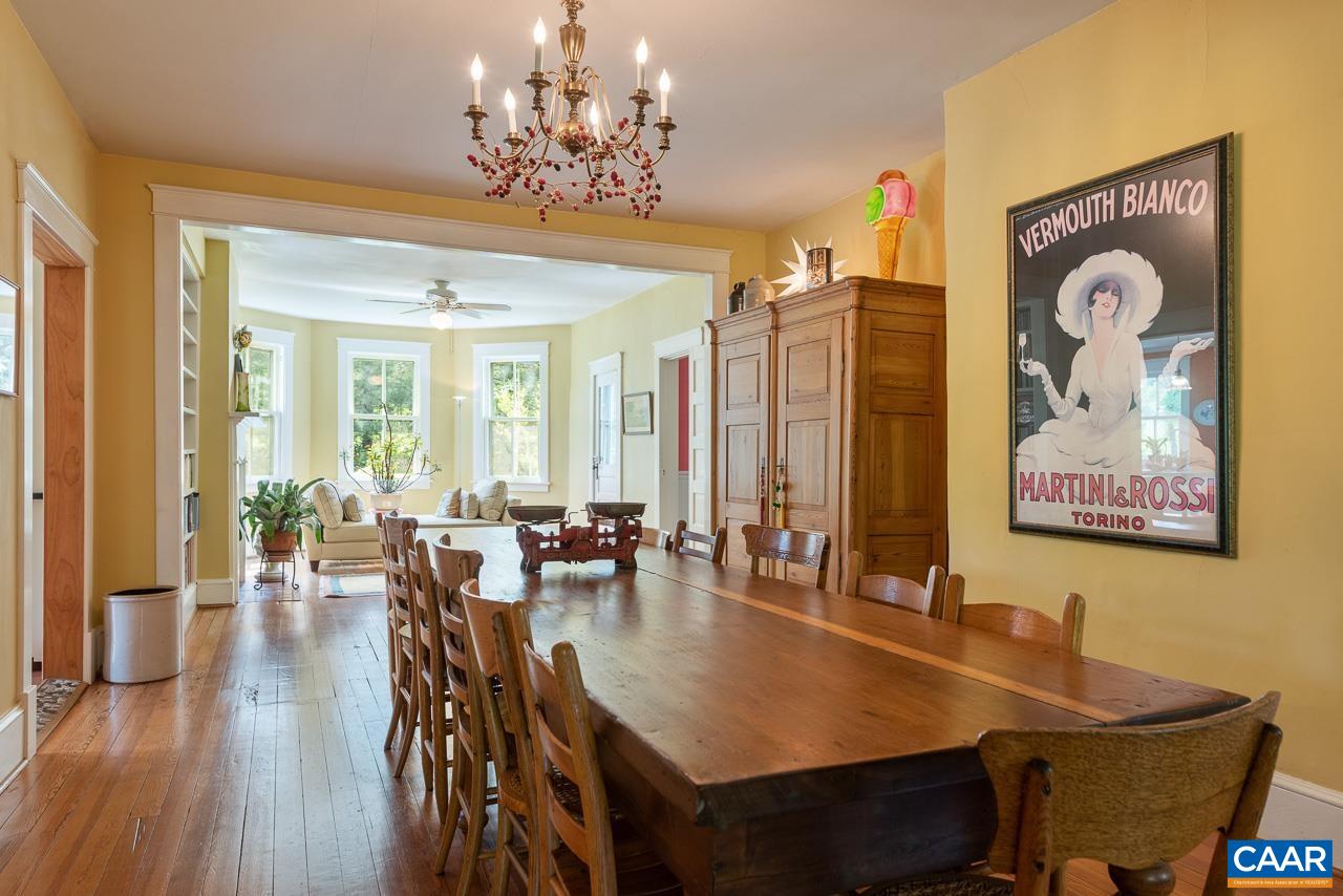3944 Stony Point Road Keswick, VA 22947 - Photo 8 of 45 a view of a dining room with furniture wooden floor and chandelier