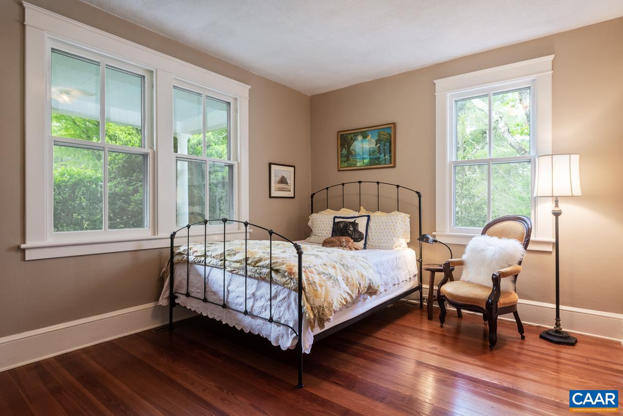 3944 Stony Point Road Keswick, VA 22947 - Photo 10 of 45 a bedroom with a bed and wooden floor