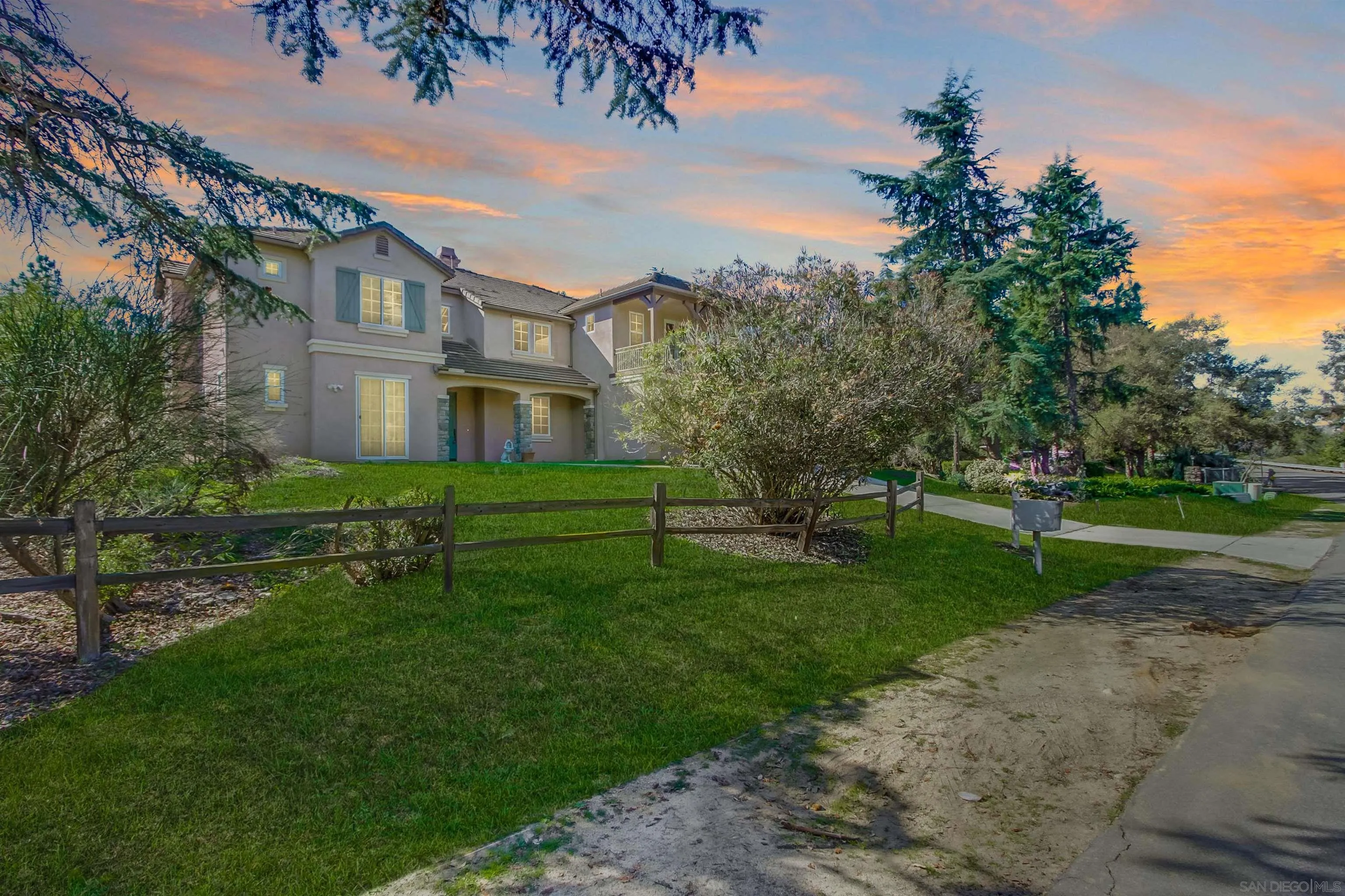 11674 Creek Road Poway, CA 92064 - Photo 12 of 70 a front view of a house with a yard table and chairs