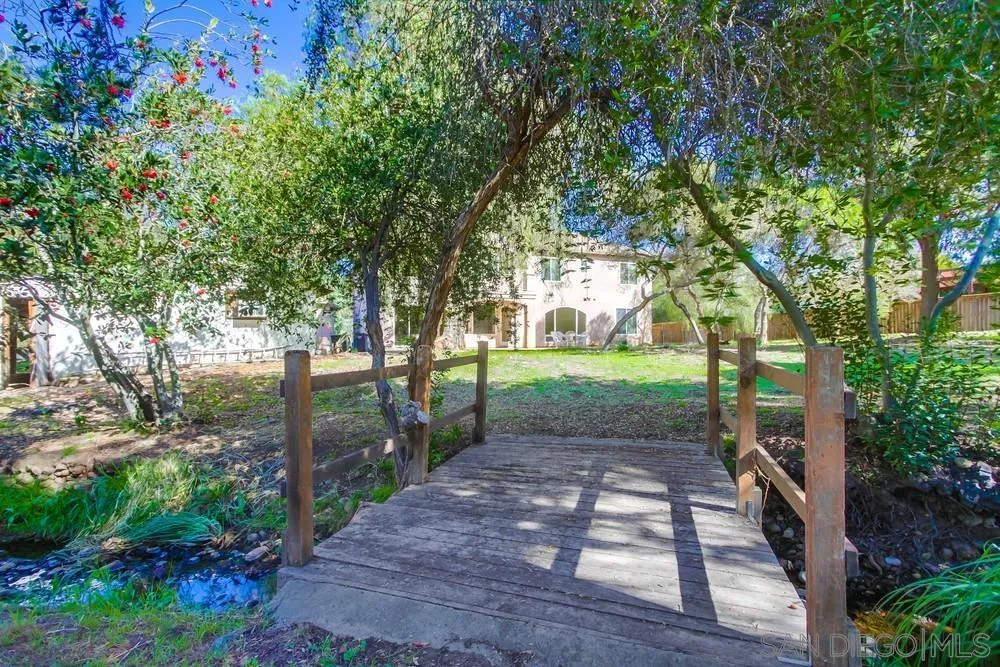 11674 Creek Road Poway, CA 92064 - Photo 14 of 70 a view of a yard with plants and trees