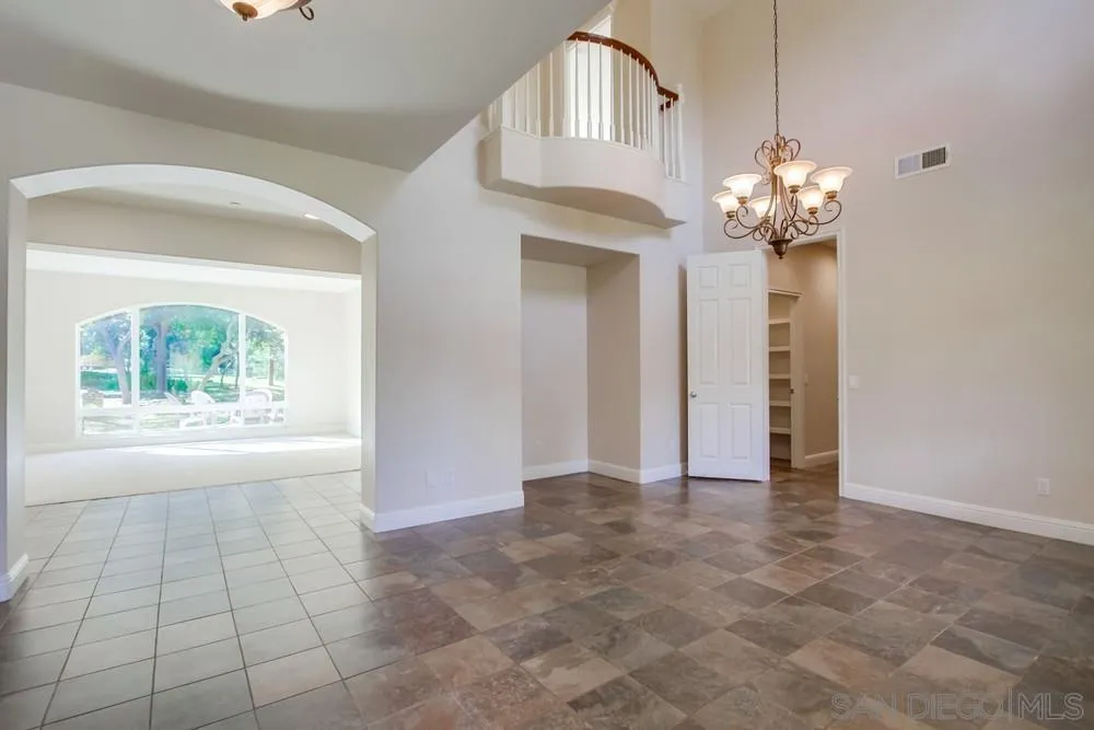 11674 Creek Road Poway, CA 92064 - Photo 16 of 70 a view of an empty room with a window