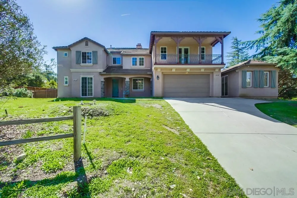 11674 Creek Road Poway, CA 92064 - Photo 2 of 70 a front view of a house with a yard