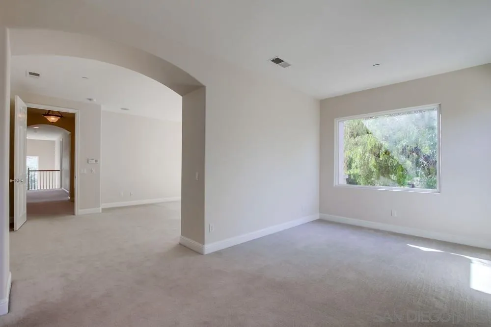 11674 Creek Road Poway, CA 92064 - Photo 28 of 70 an empty room with windows and closet