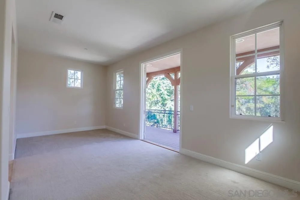 11674 Creek Road Poway, CA 92064 - Photo 32 of 70 an empty room with windows