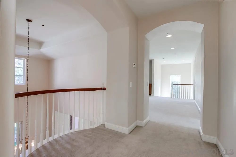 11674 Creek Road Poway, CA 92064 - Photo 34 of 70 a view of a hallway with wooden floor