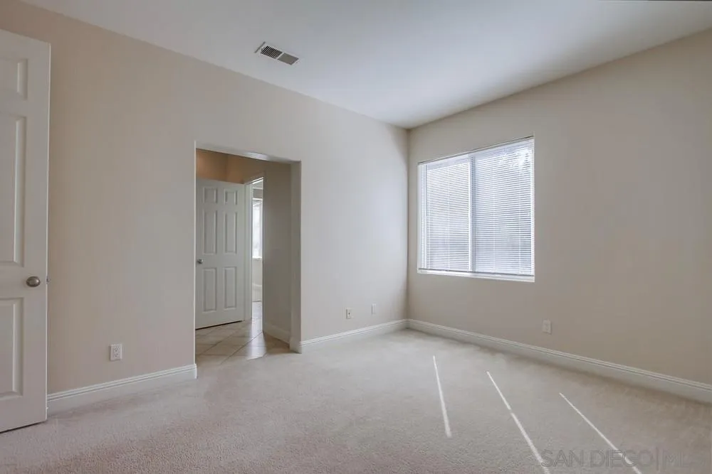 11674 Creek Road Poway, CA 92064 - Photo 37 of 70 an empty room with windows and closet
