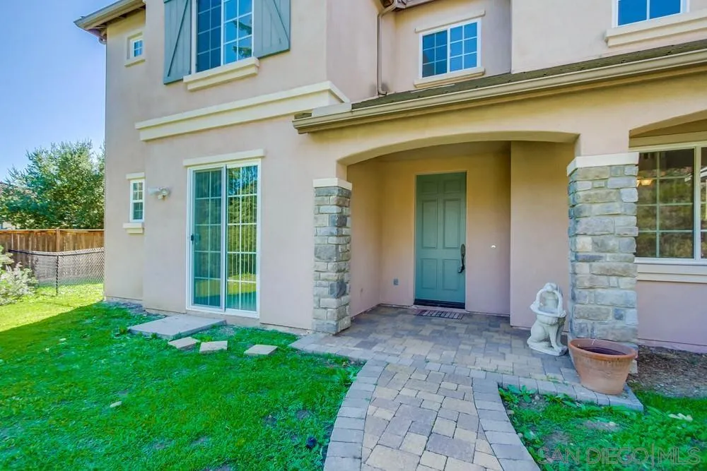 11674 Creek Road Poway, CA 92064 - Photo 4 of 70 a view of a house with a yard and plants