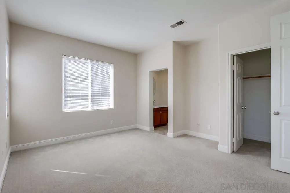11674 Creek Road Poway, CA 92064 - Photo 41 of 70 an empty room with windows and closet