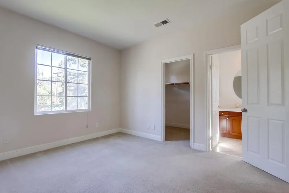 11674 Creek Road Poway, CA 92064 - Photo 44 of 70 an empty room with a window and a kitchen