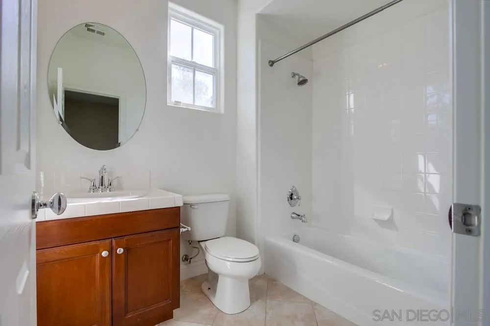 11674 Creek Road Poway, CA 92064 - Photo 48 of 70 a bathroom with a sink a toilet and shower