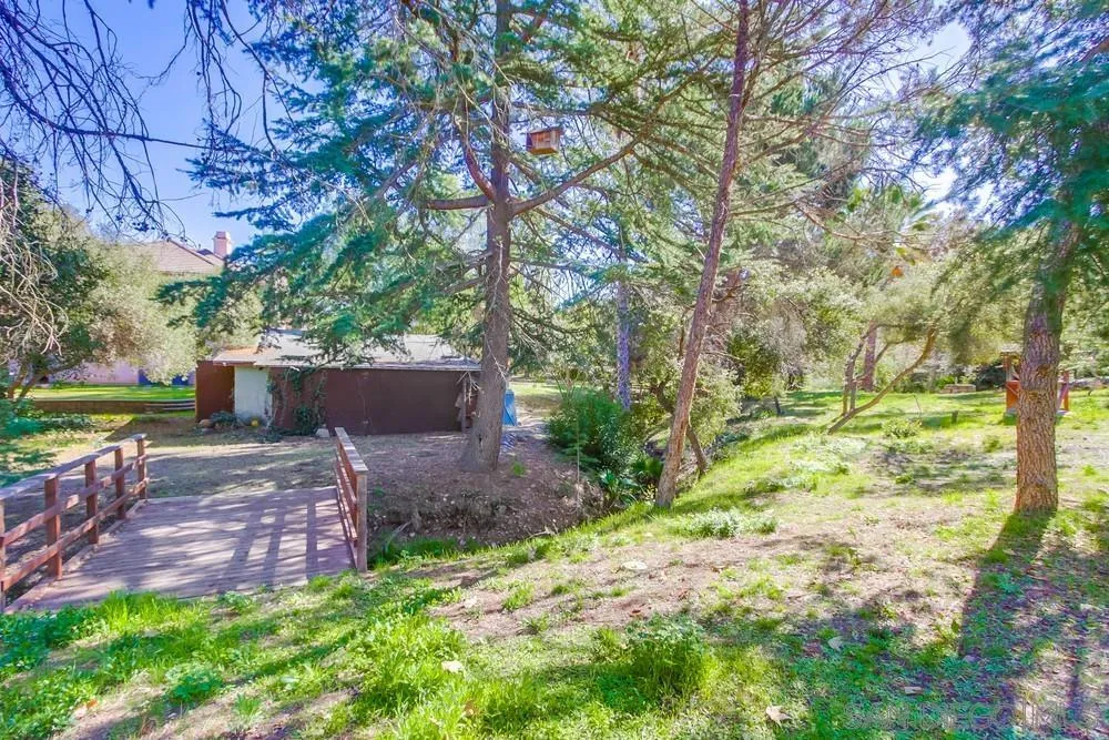 11674 Creek Road Poway, CA 92064 - Photo 58 of 70 a backyard of a house with lots of green space