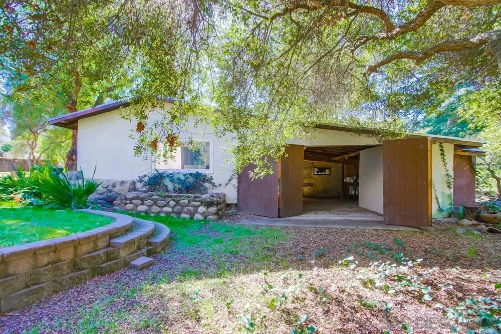 11674 Creek Road Poway, CA 92064 - Photo 62 of 70 a view of a house with a yard and plants