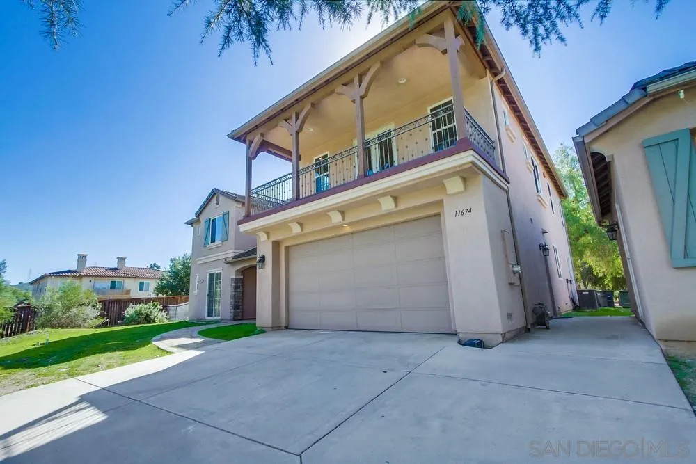 11674 Creek Road Poway, CA 92064 - Photo 69 of 70 a view of a white house with many windows and yard