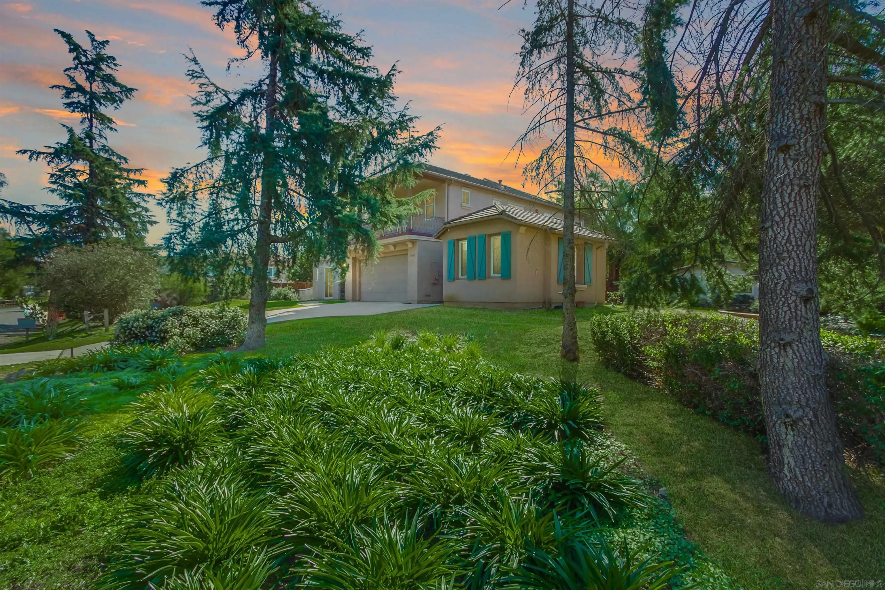 11674 Creek Road Poway, CA 92064 - Photo 10 of 70 a front view of a house with yard and green space