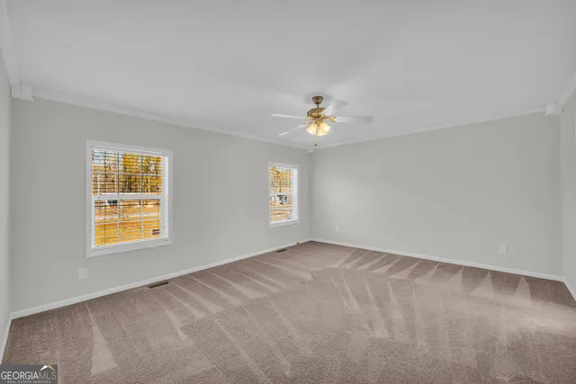 a view of an empty room with a window