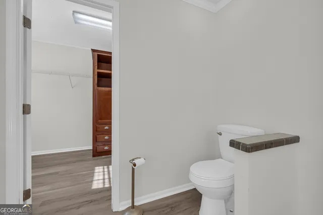 a bathroom with a toilet and a sink