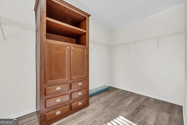 an empty room with wooden floor