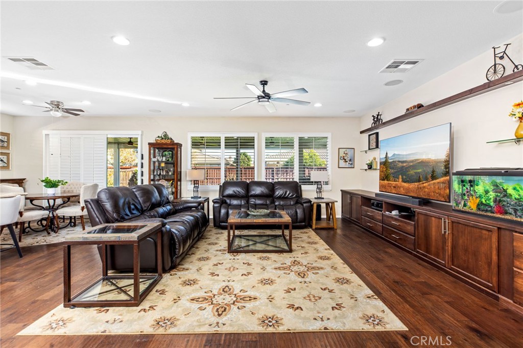 28386 Fox Ridge Cove Menifee, CA 92585 - Photo 12 of 48 a living room with furniture and a flat screen tv
