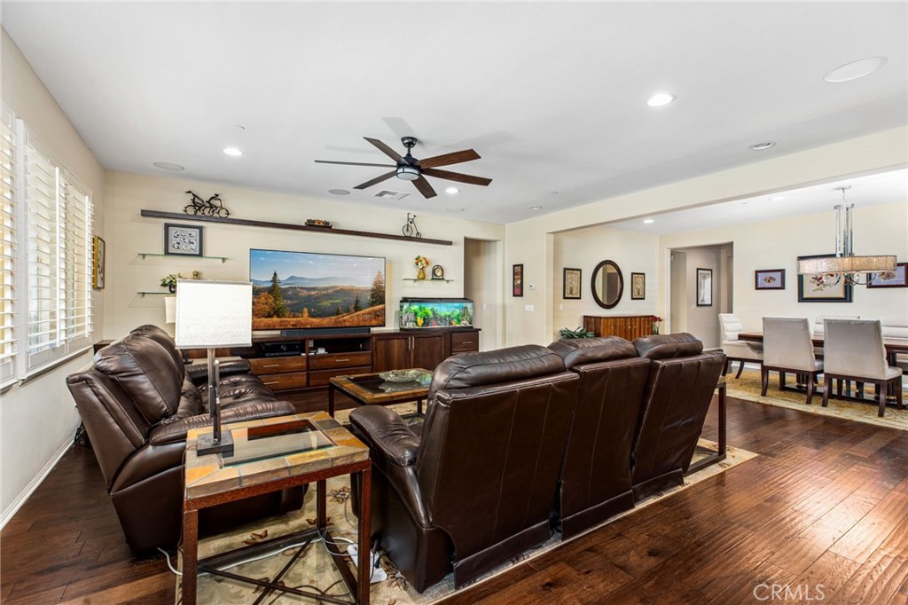 28386 Fox Ridge Cove Menifee, CA 92585 - Photo 15 of 48 a living room with furniture a ceiling fan and a window