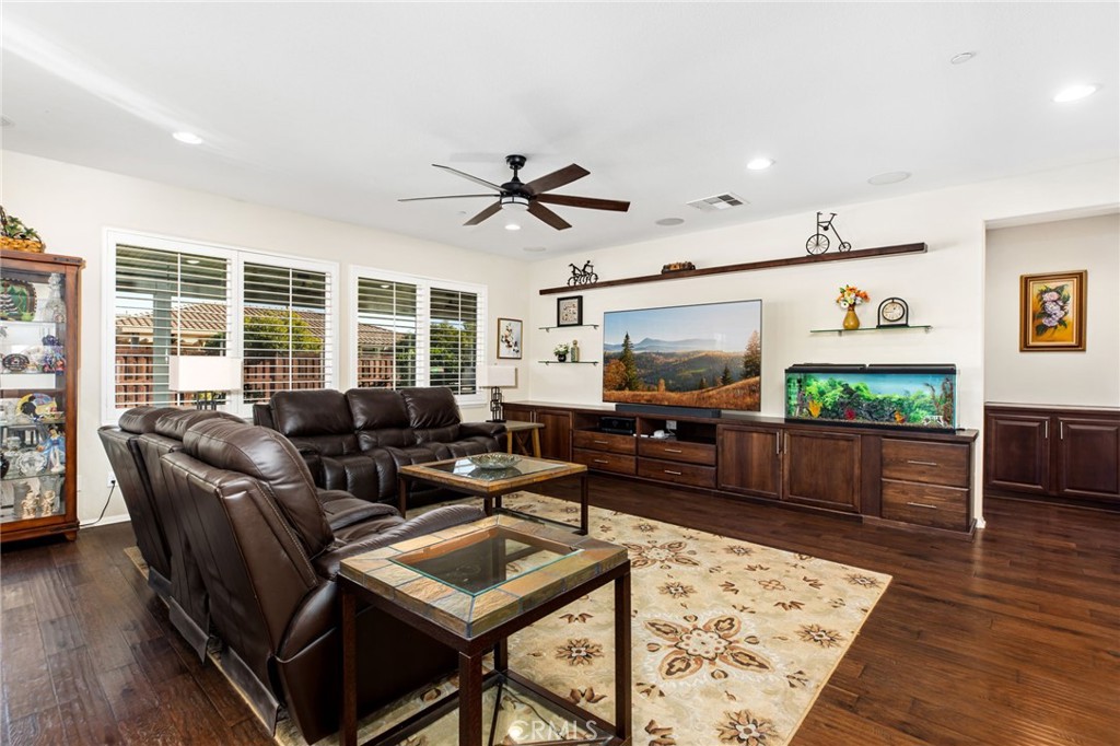 28386 Fox Ridge Cove Menifee, CA 92585 - Photo 18 of 48 a living room with furniture and a flat screen tv