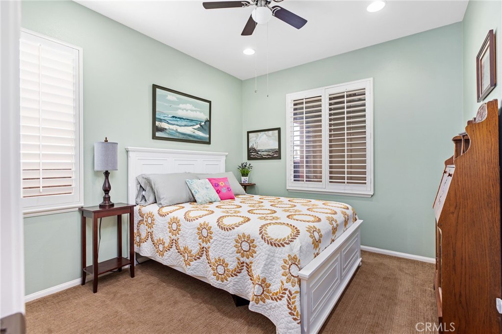 28386 Fox Ridge Cove Menifee, CA 92585 - Photo 27 of 48 a bedroom with a bed and a window