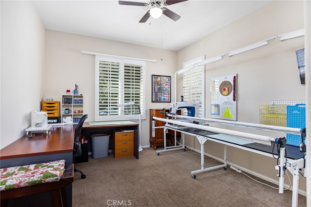 28386 Fox Ridge Cove Menifee, CA 92585 - Photo 28 of 48 a view of a workspace with furniture and a window