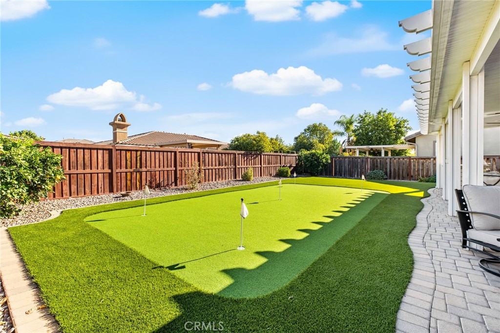 28386 Fox Ridge Cove Menifee, CA 92585 - Photo 31 of 48 a view of a swimming pool with a yard