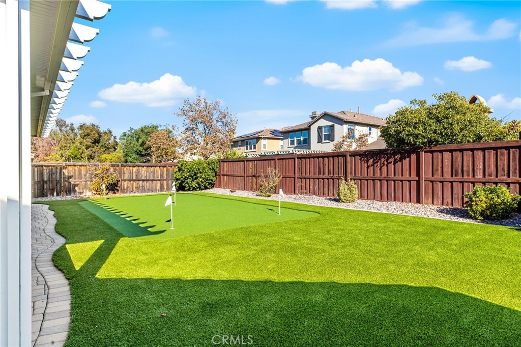 28386 Fox Ridge Cove Menifee, CA 92585 - Photo 33 of 48 a view of a garden with a slide
