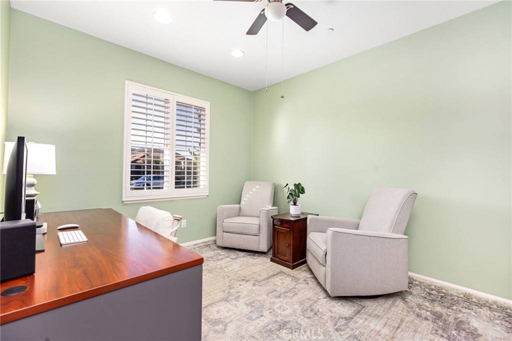 28386 Fox Ridge Cove Menifee, CA 92585 - Photo 6 of 48 a living room with furniture and a flat screen tv