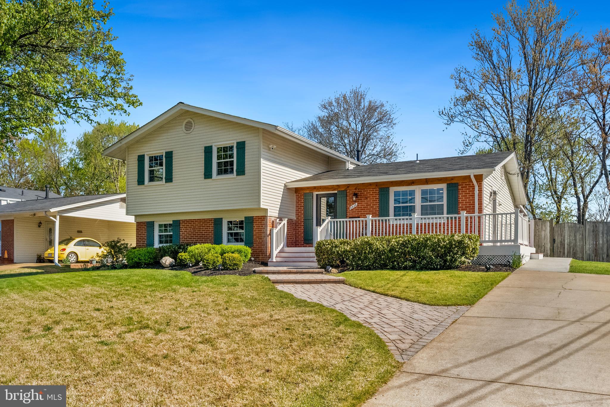 6426 Meriwether Lane Springfield, VA 22150 - Photo 1 of 1 a front view of a house with garden