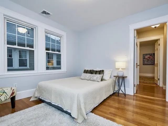 a bedroom with double bed and a window