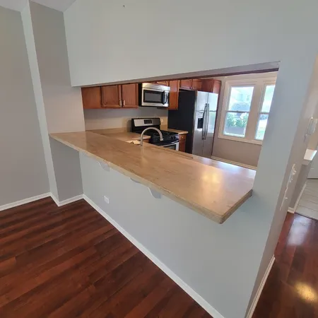 a view of kitchen with furniture and large window