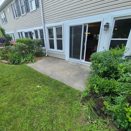 a view of a two chairs in the patio