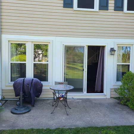 a view of an ocean beach and residential house