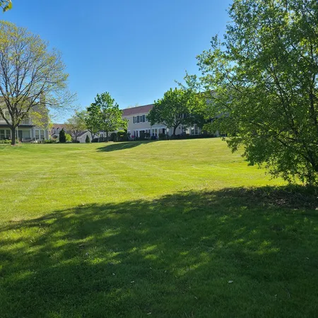 a view of a golf course with a lake