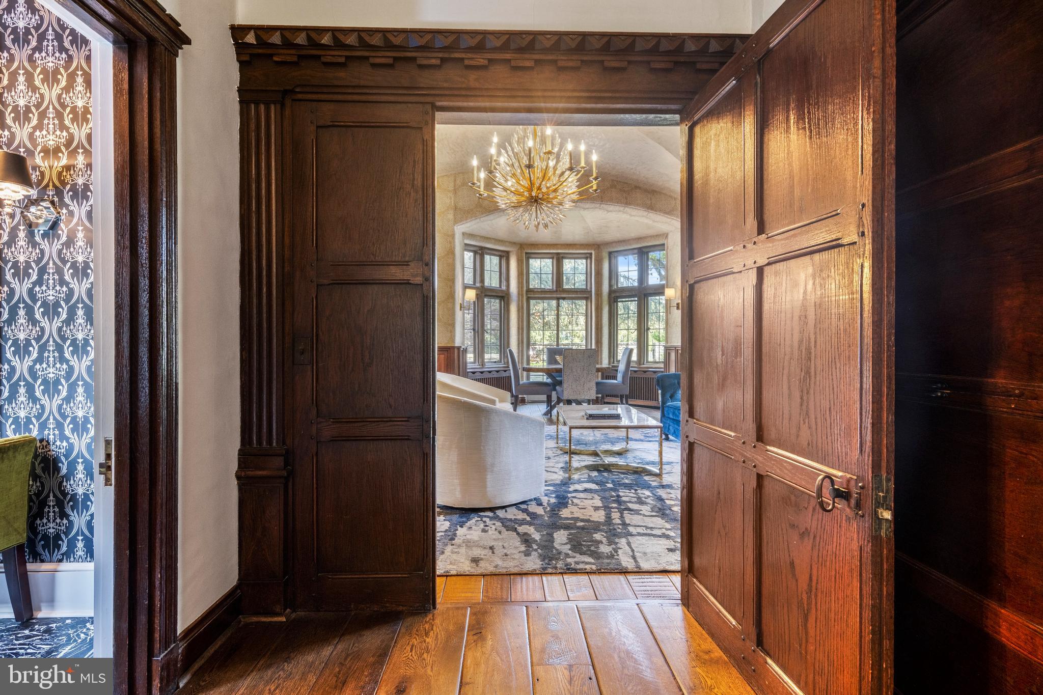 209 Tower Road Villanova, PA 19085 - Photo 20 of 110 Wood paneled doors open to sitting/dining room