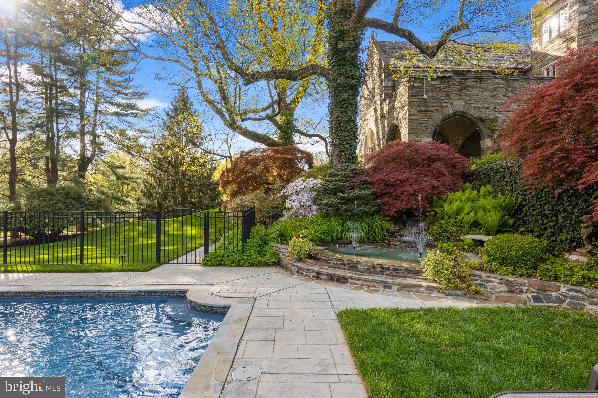 209 Tower Road Villanova, PA 19085 - Photo 83 of 110 Step down to the corner fountain w/ waterfall