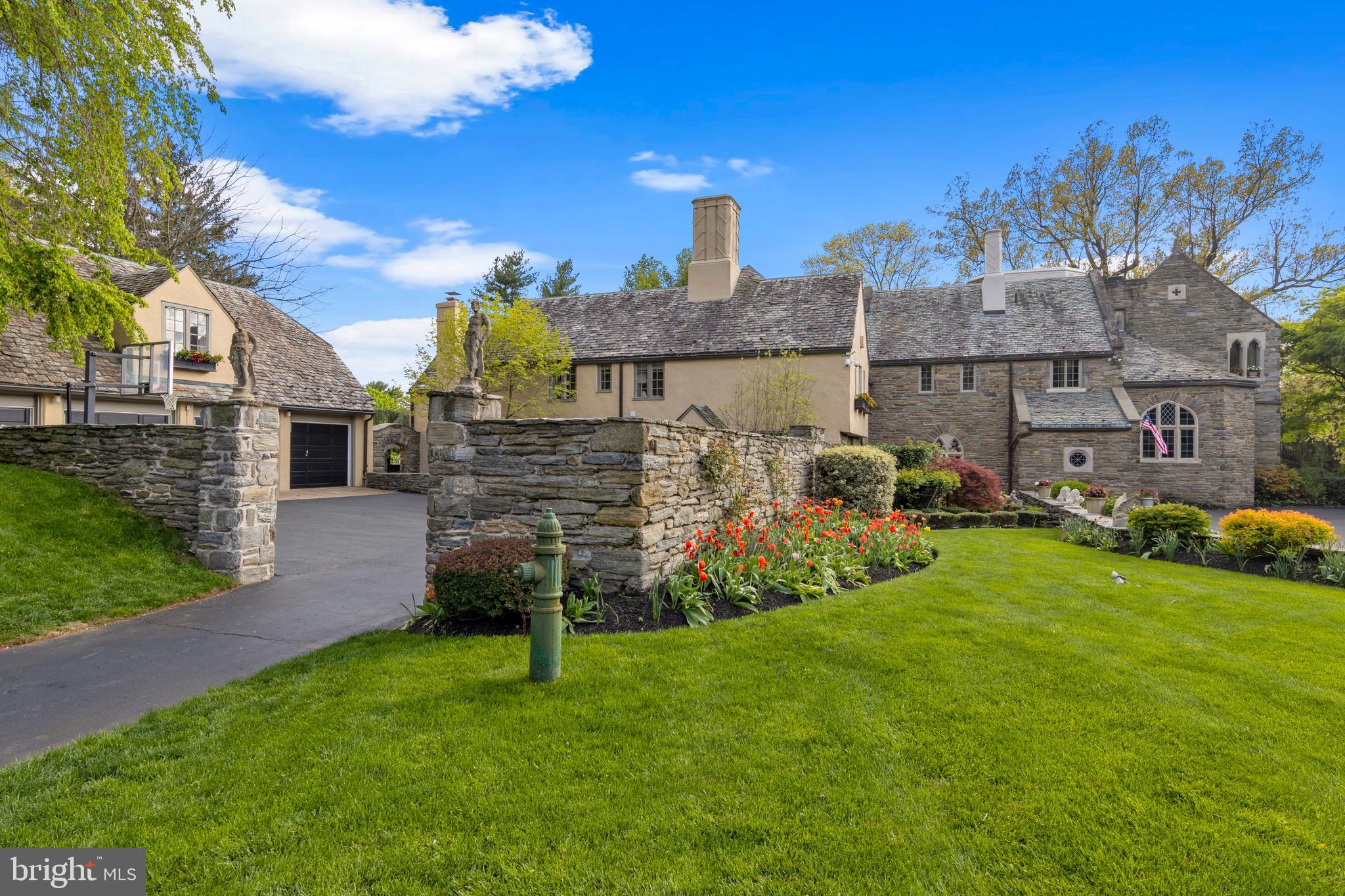 209 Tower Road Villanova, PA 19085 - Photo 94 of 110 enter garage courtyard thru stone wall w/ statues