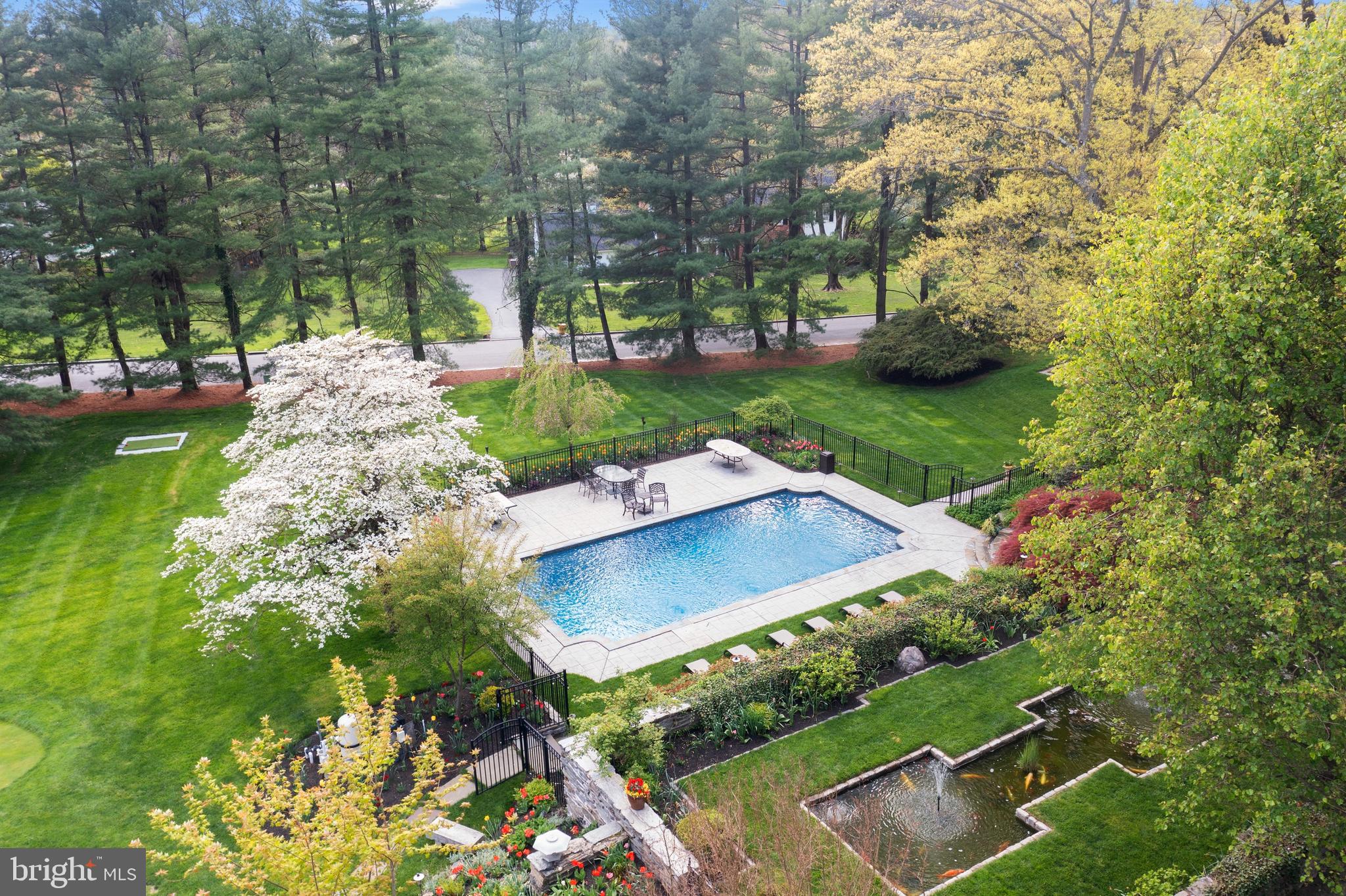 209 Tower Road Villanova, PA 19085 - Photo 96 of 110 aerial view of pool and magnificent pine trees