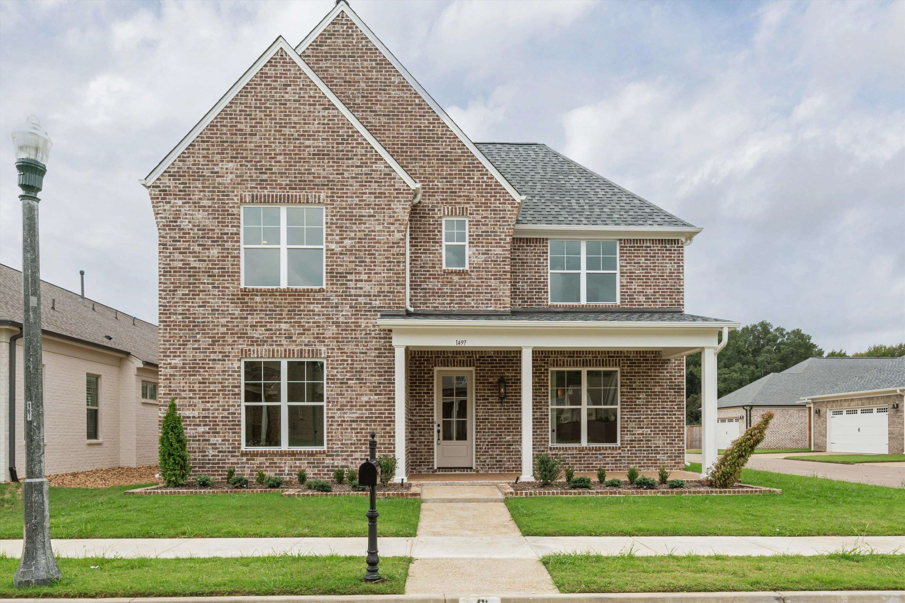1497 Vireo Drive Collierville, TN 38017 - Photo 1 of 30 front view of a house with a yard