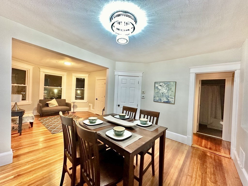 28-30 Kendall Street Springfield, MA 01104 - Photo 2 of 10 a view of a dining room with furniture and wooden floor