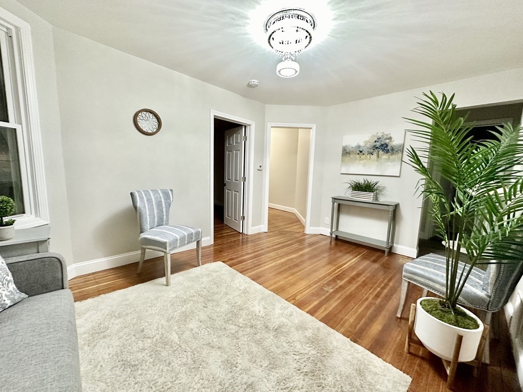 28-30 Kendall Street Springfield, MA 01104 - Photo 9 of 10 a living room with furniture and a table