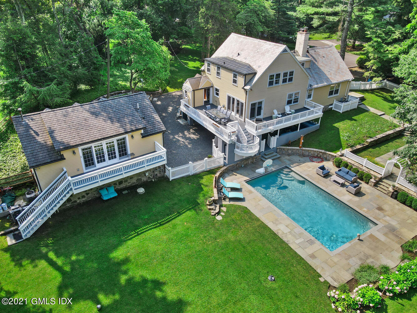 an aerial view of a house with a backyard