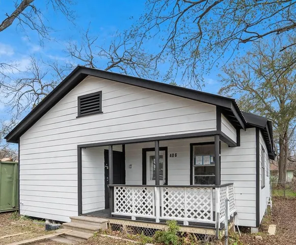 a front view of a house with a garage
